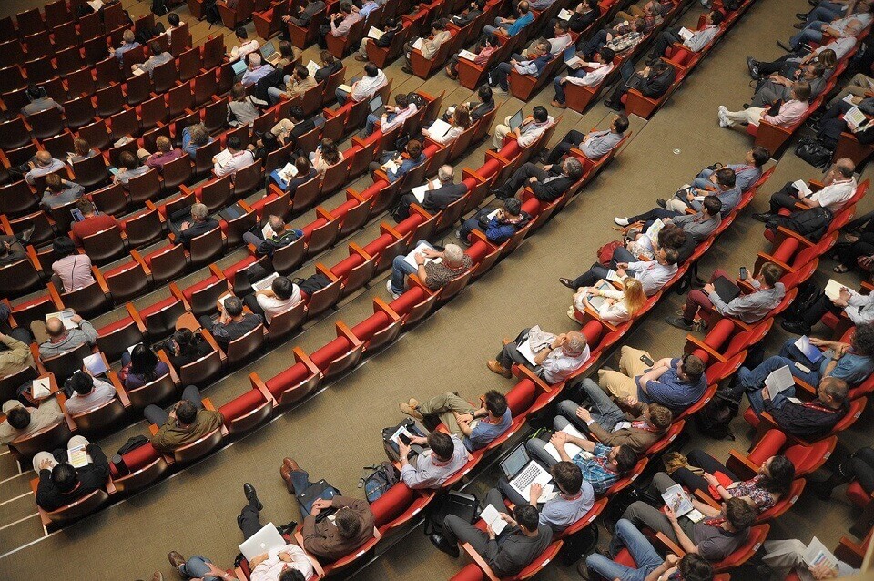 people seated in auditorium