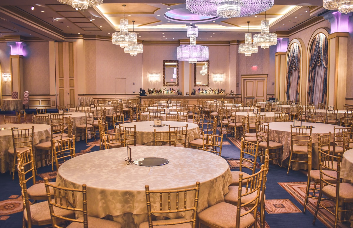 hotel event room with chairs and tables