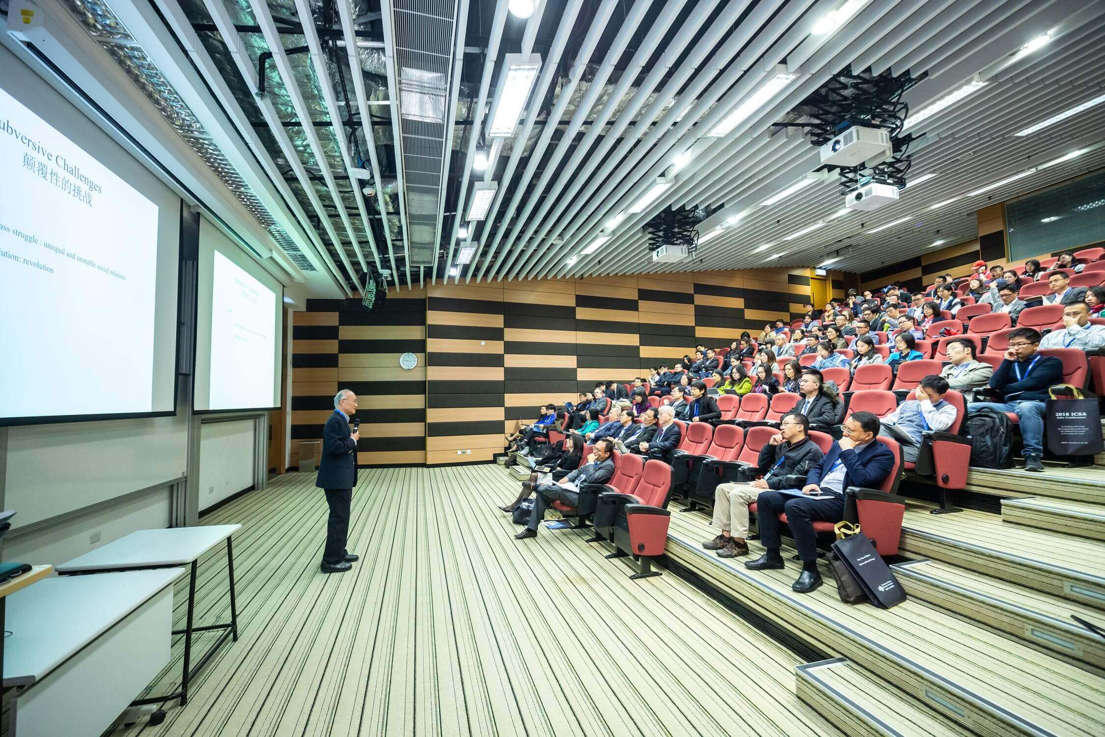 man presenting in front of audience