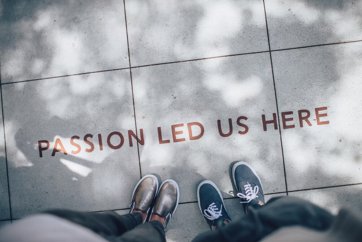 “Passion led us here” written on pavement