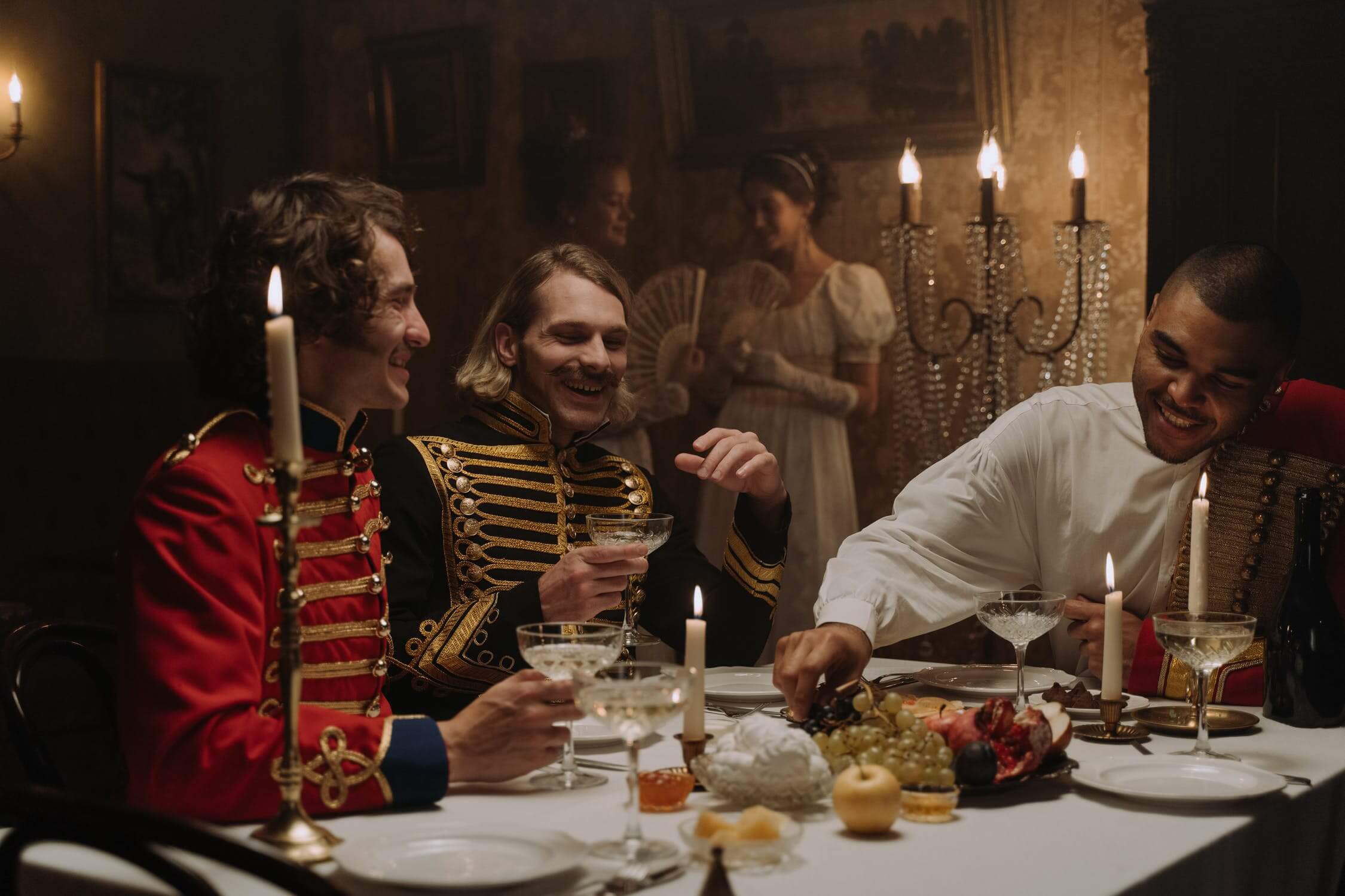 people dressed in period pieces at table