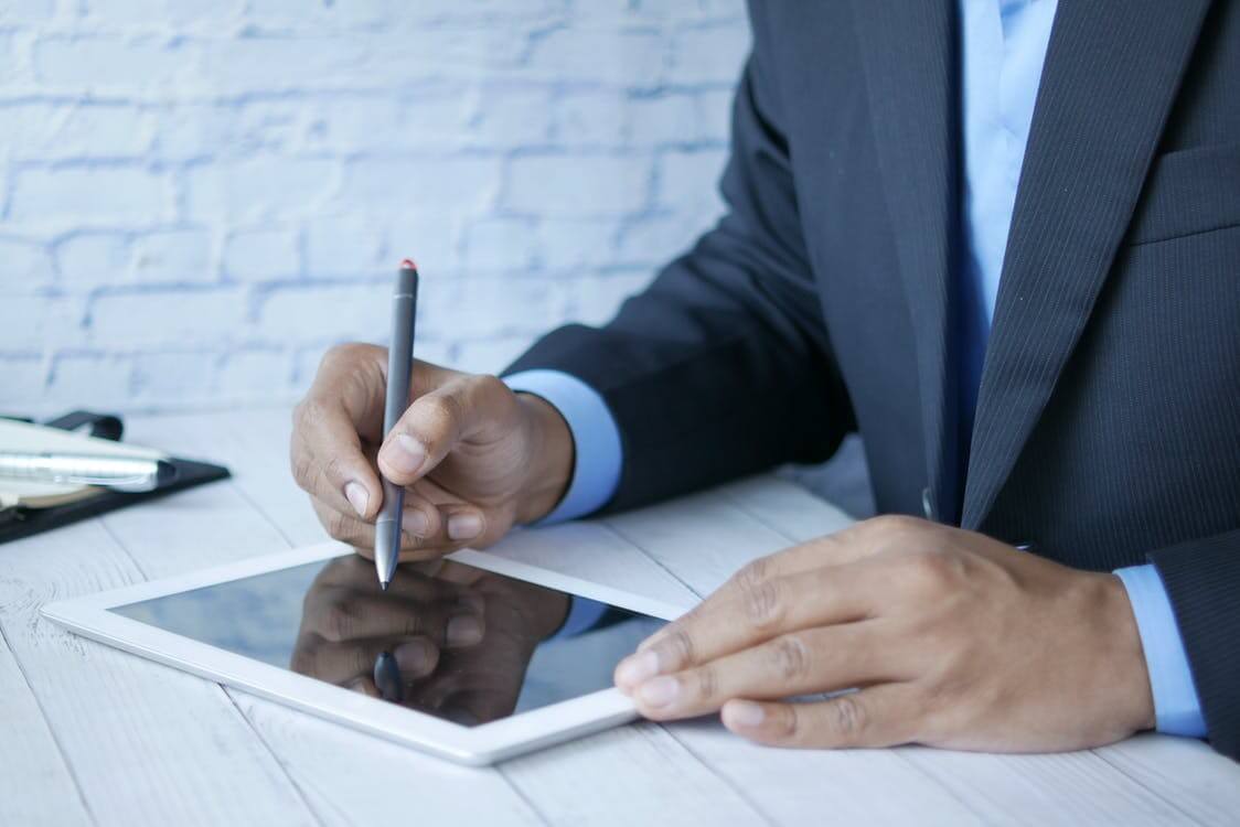 man working with teh tablet